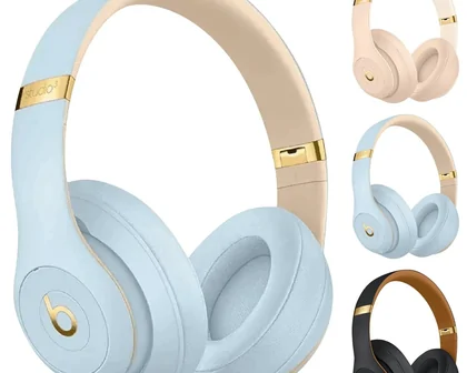 Pale blue over-ear headphones with gold accents