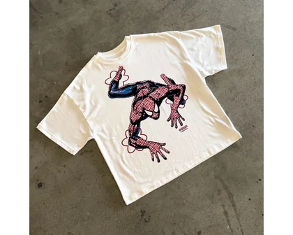 Cream T-shirt with a red and black character graphic